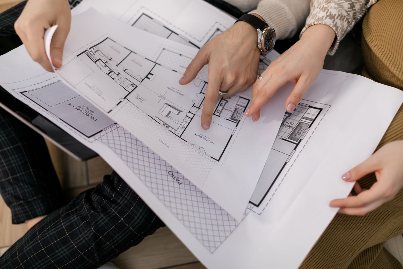 ACCO architects reviewing house floor plan drawings in Lahore