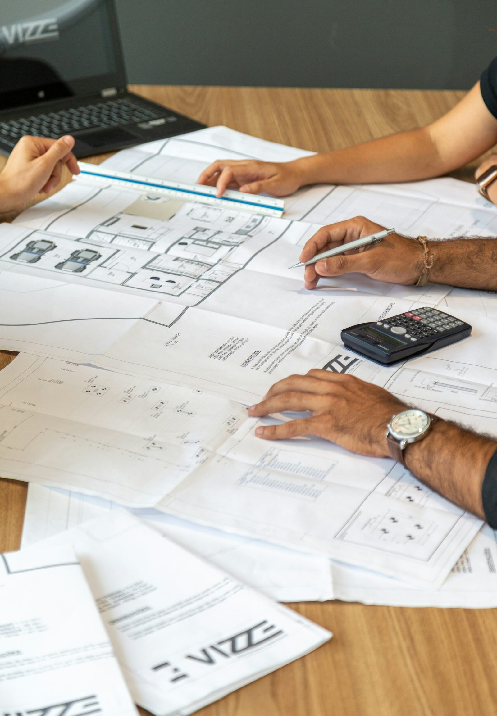 Architect reviewing architectural working drawings and floor plans