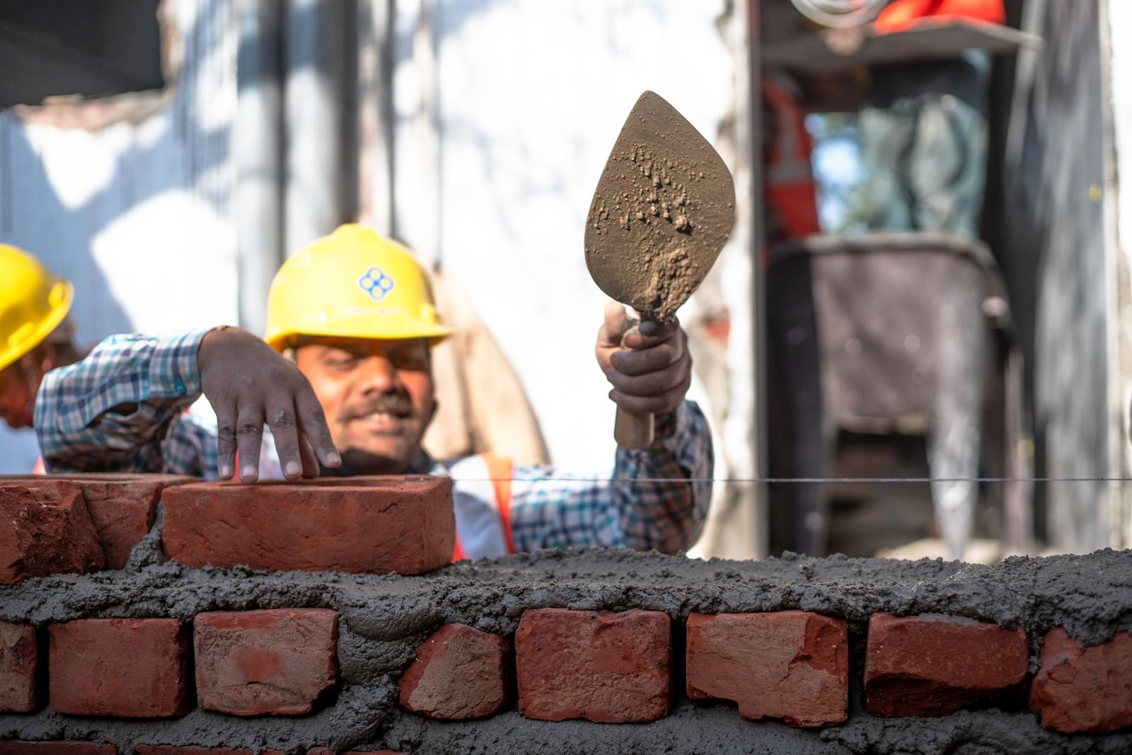 Bricklayer laying first-class bricks on a house site in Bahria Town Lahore