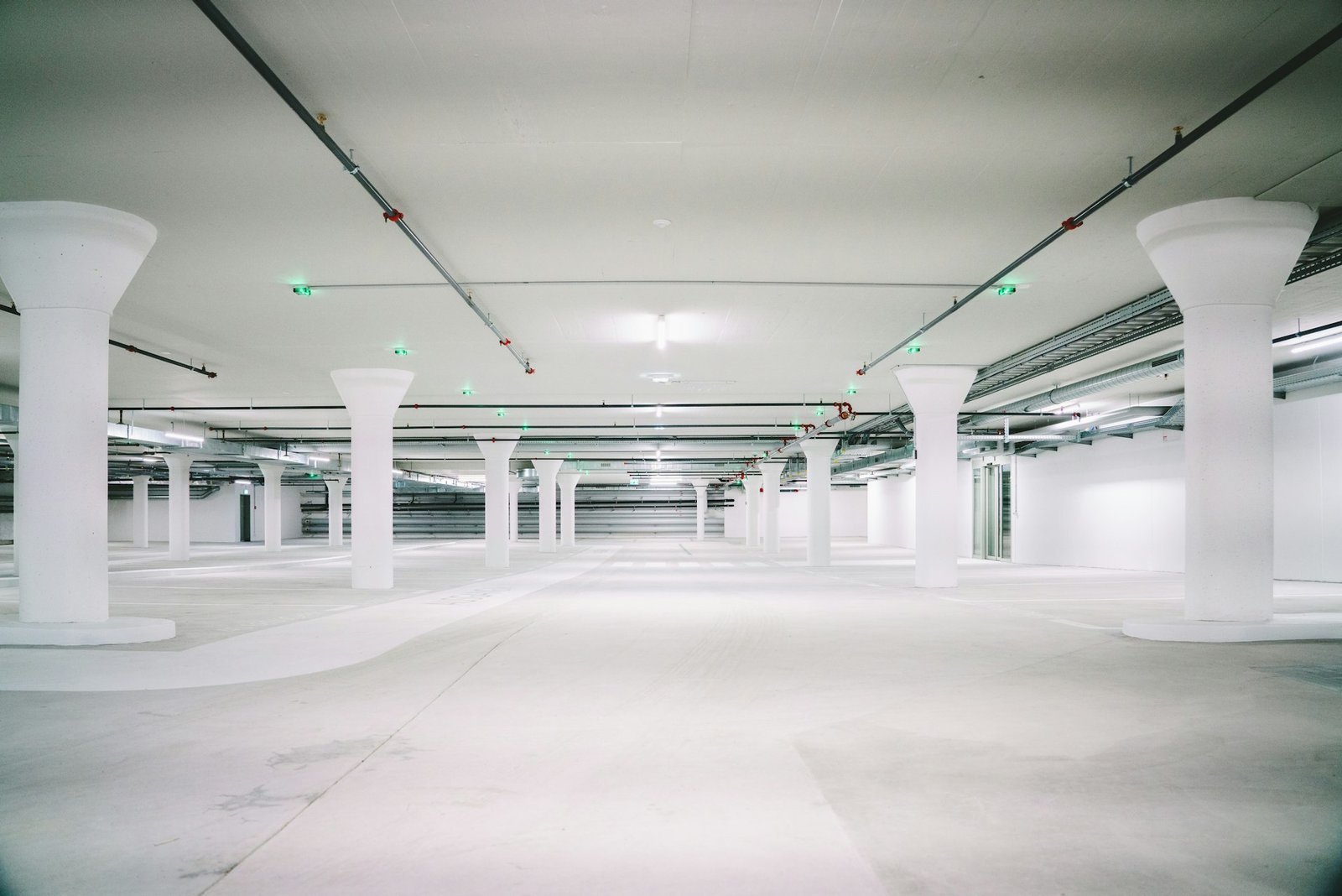 Commercial building basement parking with epoxy floor and lighting