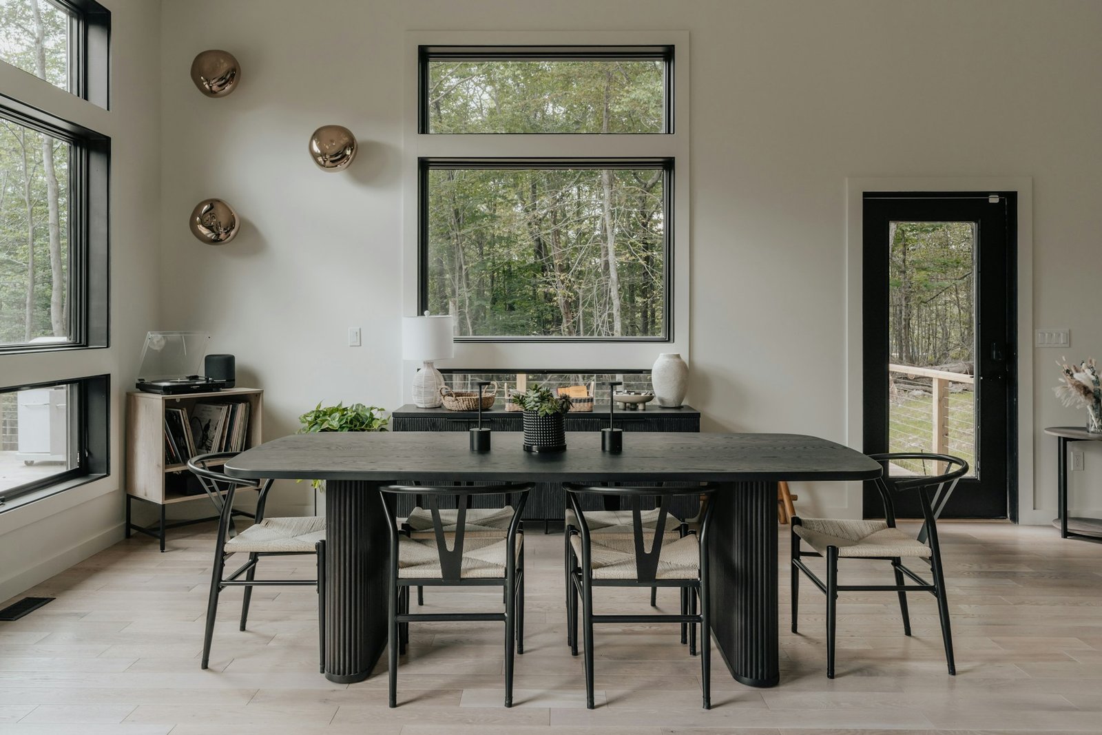 Dining room interior design with dark wood table and pendant light