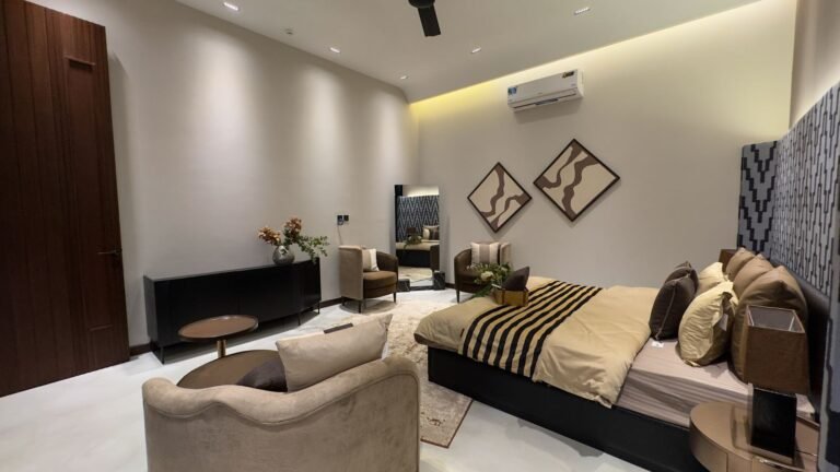 Master bedroom interior with false ceiling lighting in a Lahore house