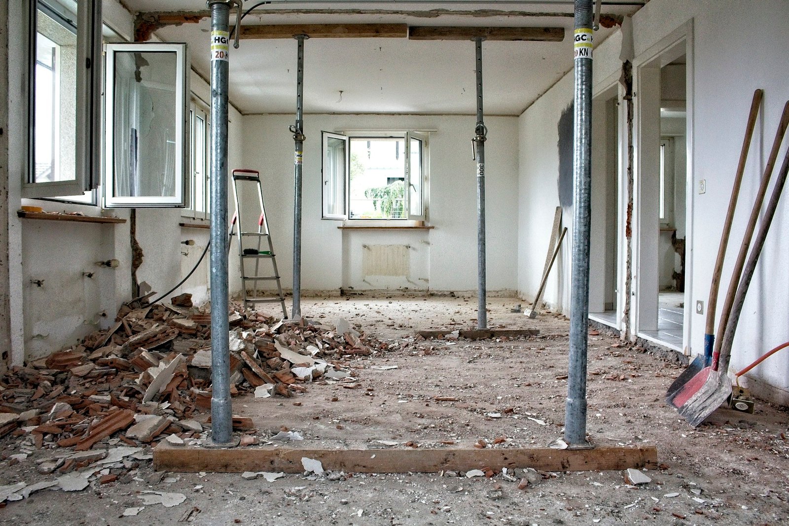 Grey structure repair and renovation with temporary steel props