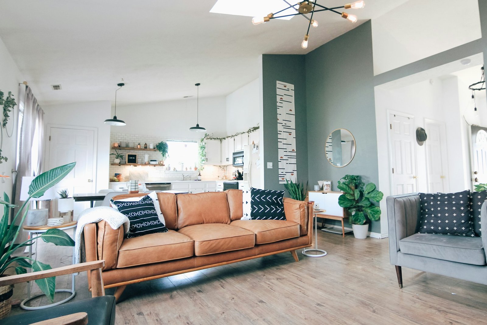 Renovated living room with modern furniture and open kitchen
