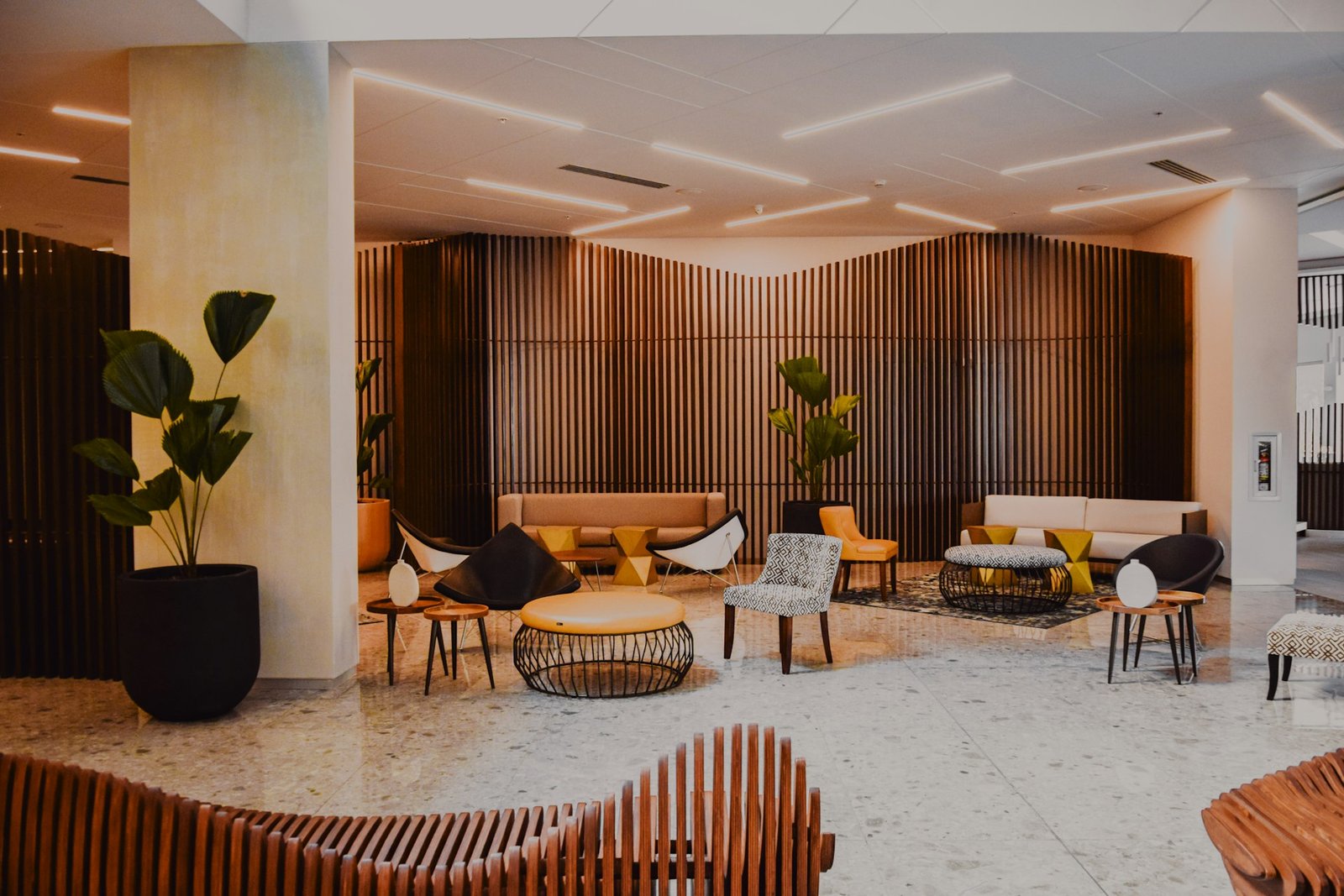 Hotel interior design with designer lobby furniture and wood walls