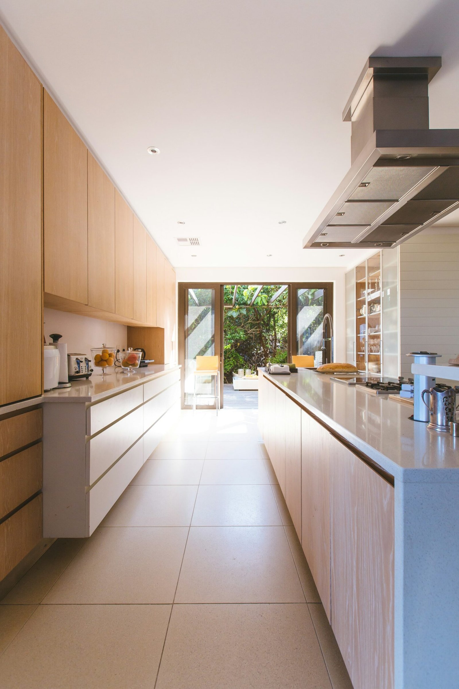 Kitchen renovation with modern wooden cabinets and long counter