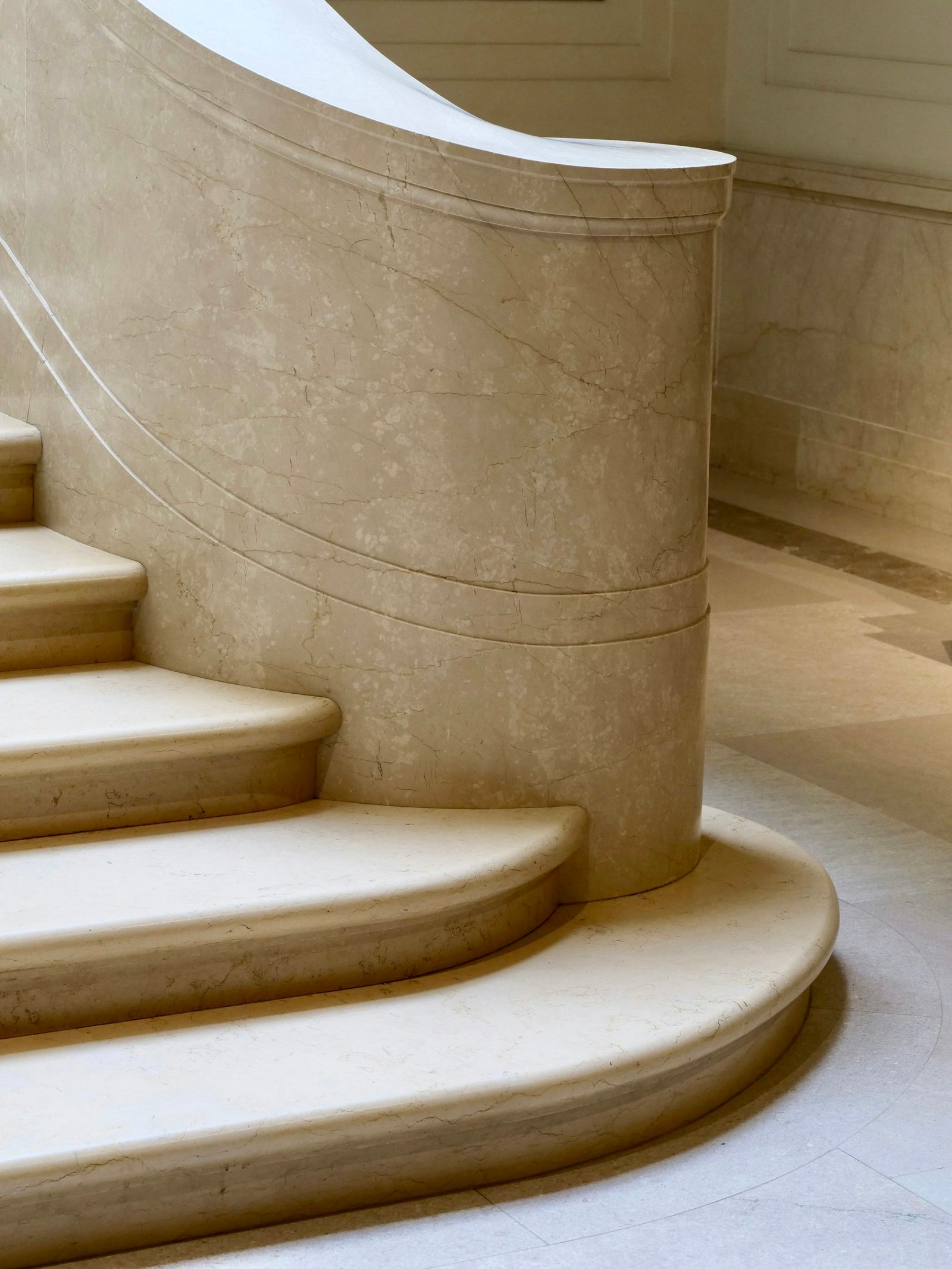 Luxury house finishing with curved marble staircase