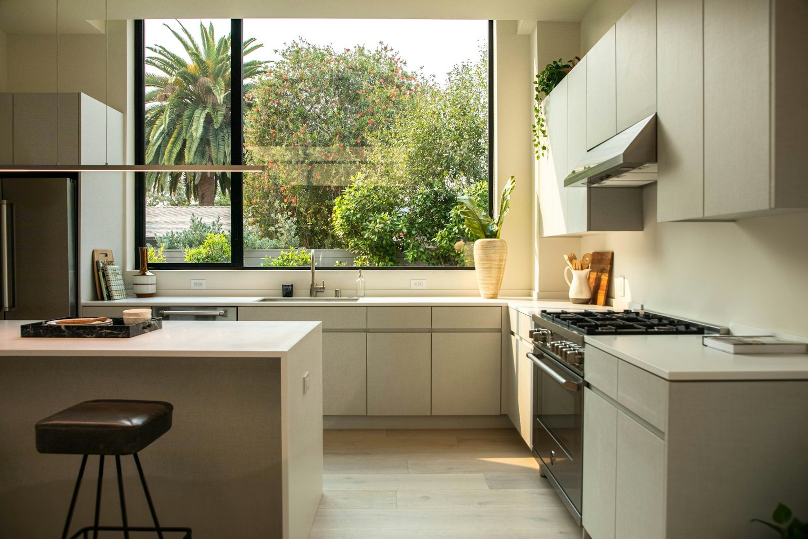 Modern kitchen design with island and large window