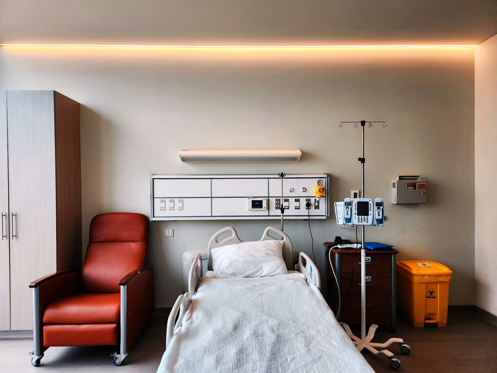 Private hospital patient room design with bedhead services